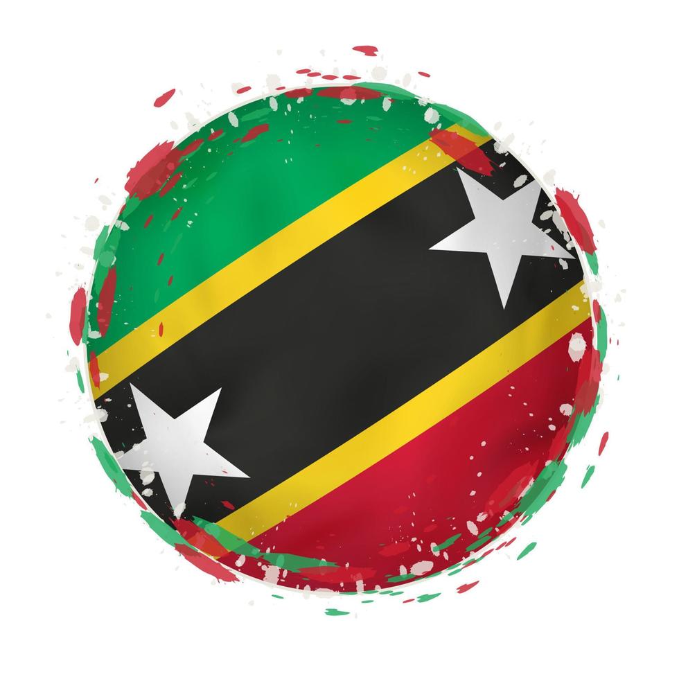 Round grunge flag of Saint Kitts and Nevis with splashes in flag color. vector