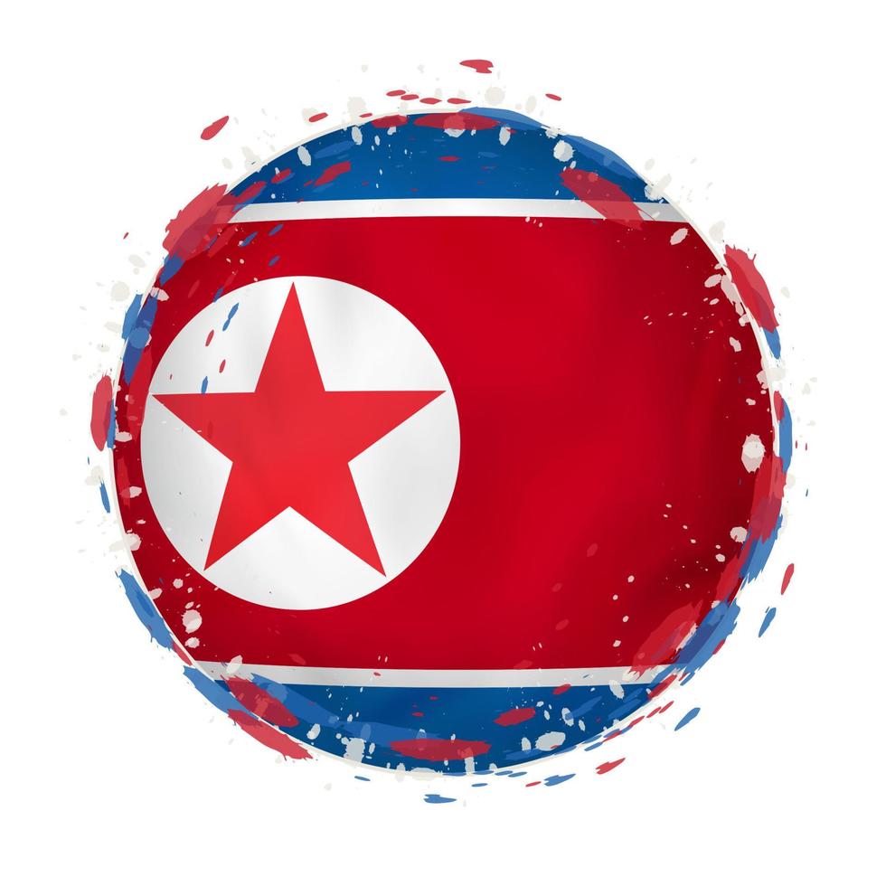 Round grunge flag of North Korea with splashes in flag color. vector