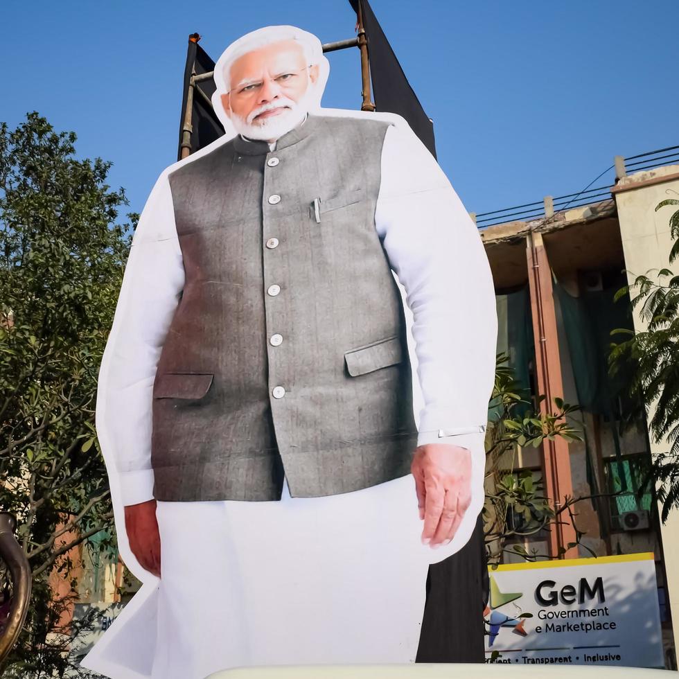 New Delhi, India - January 16 2023 - Prime Minister Narendra Modi cut out during BJP road show, the statue of PM Modi while attending a big election rally in the capital photo