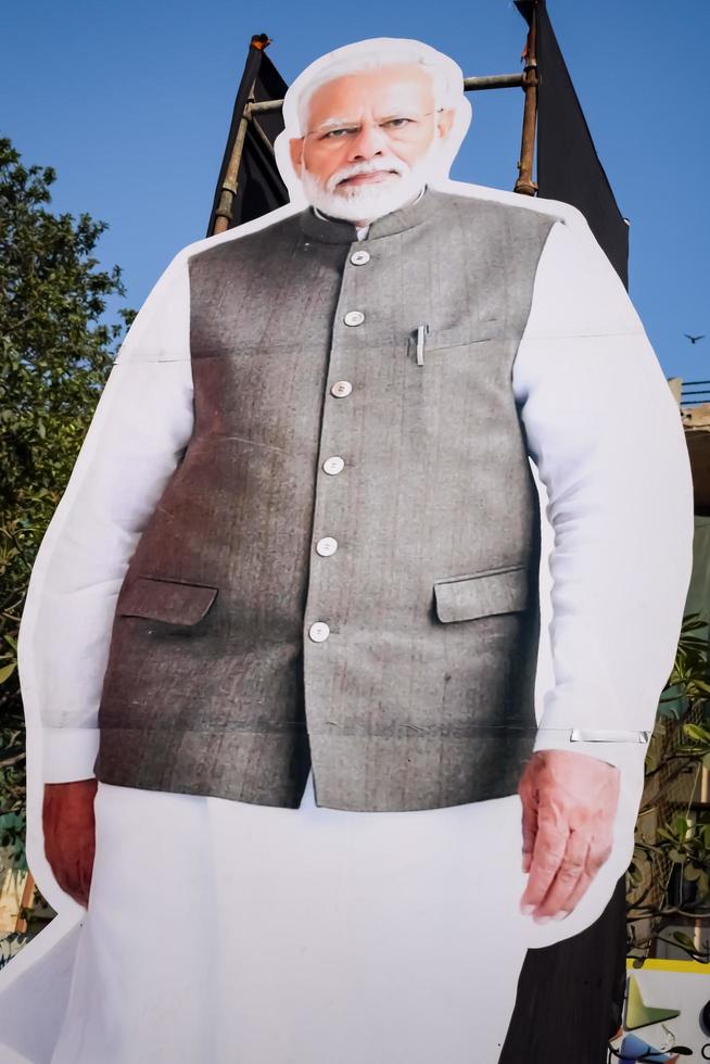New Delhi, India - January 16 2023 - Prime Minister Narendra Modi cut out during BJP road show, the statue of PM Modi while attending a big election rally in the capital photo