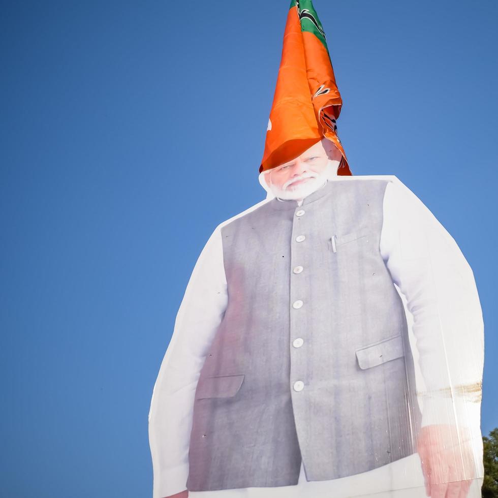 New Delhi, India - January 16 2023 - Prime Minister Narendra Modi cut out during BJP road show, the statue of PM Modi while attending a big election rally in the capital photo