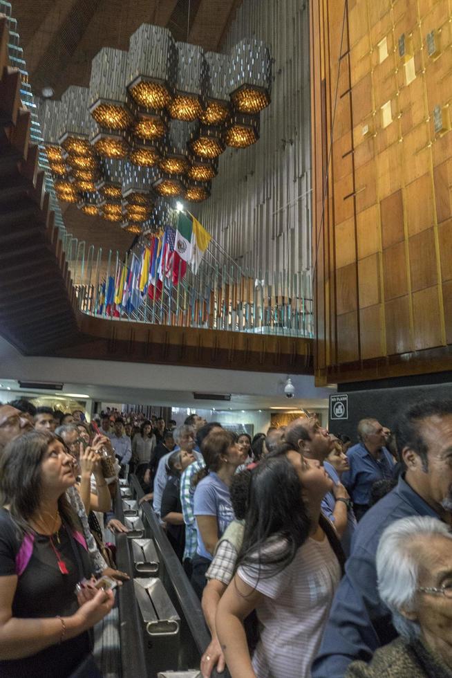 MEXICO CITY, MEXICO - NOVEMBER 4 2017 - Pilgrims at Guadalupe Cathedral photo