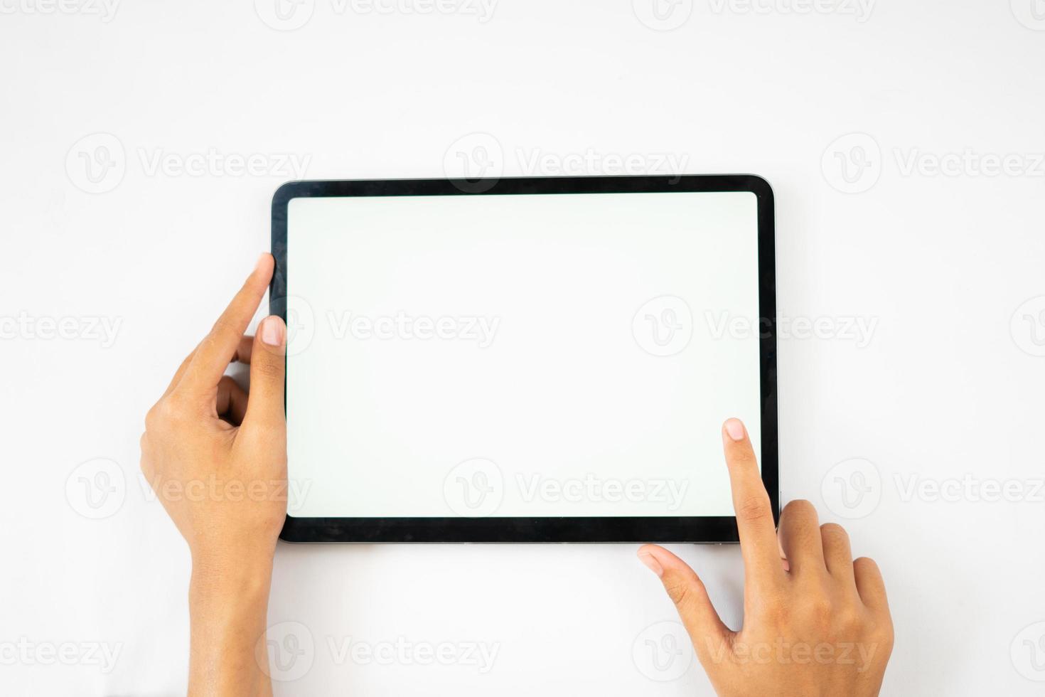 hands holding blank screen tablet for mockups photo