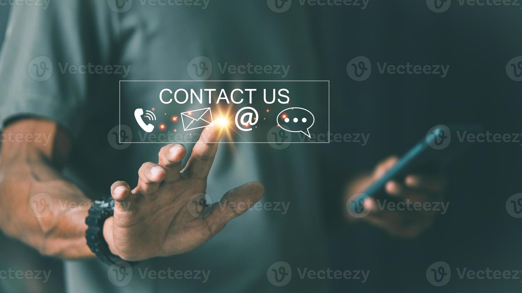 Contact us or Customer support hotline people connect. Businessman using smart phone and touching on virtual screen contact icons email, telephone, address, live chat, photo