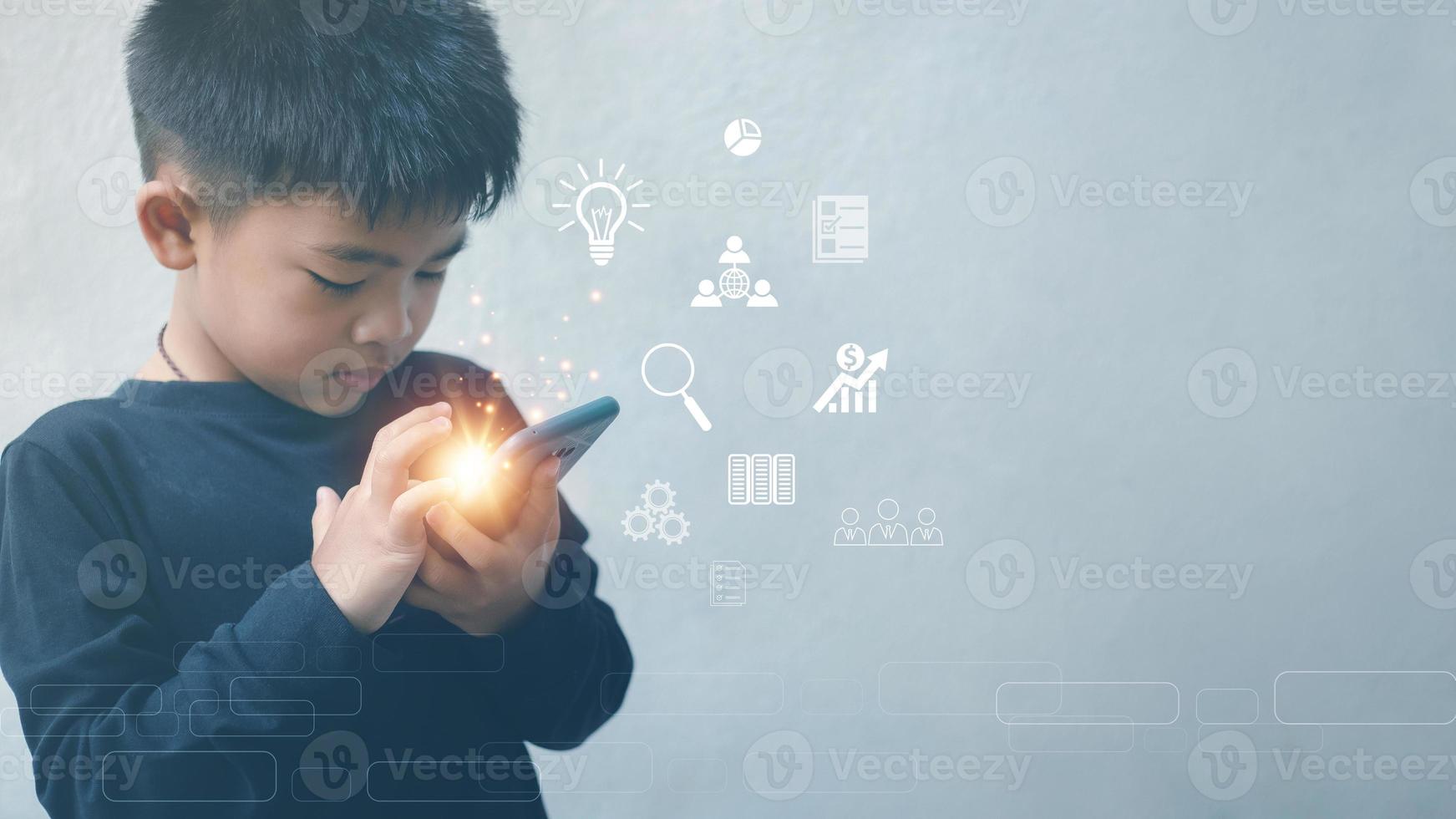 Boy touching mobile phone with hand To access the search for information, ideas, document management electronically. data storage global internet connection application photo