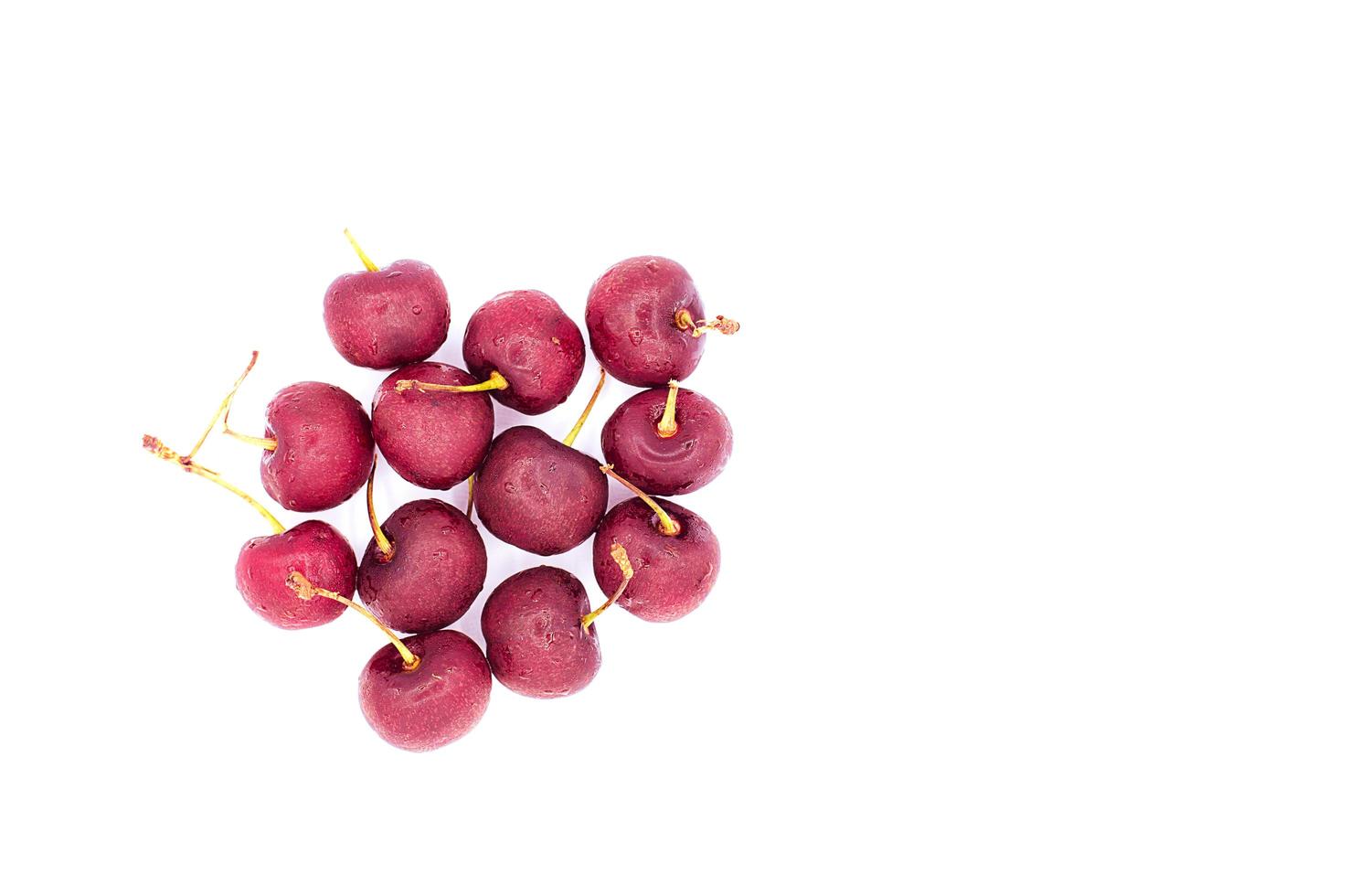 Red cherry isolated on white background. The cherry is a fruit with substantial medicinal and nutritional qualities. photo