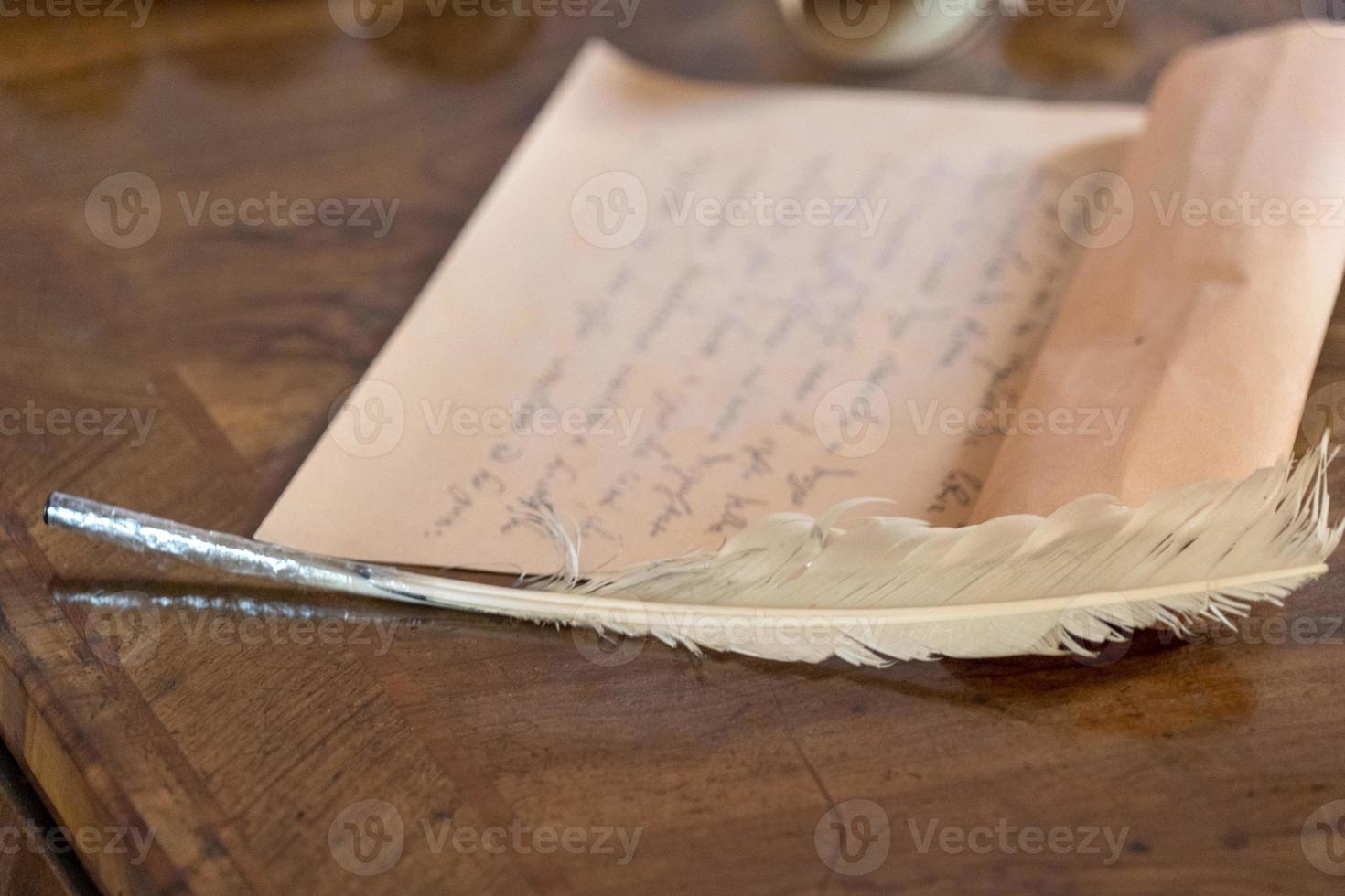 Plume and hand written letter photo