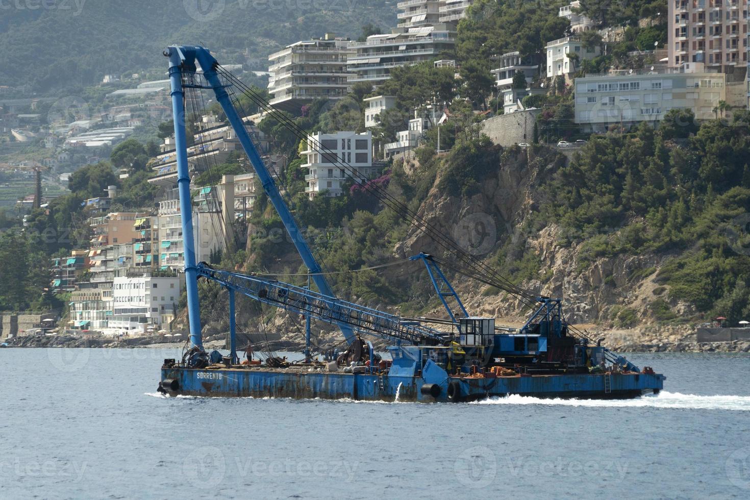 Harbor port dredge working on sea photo