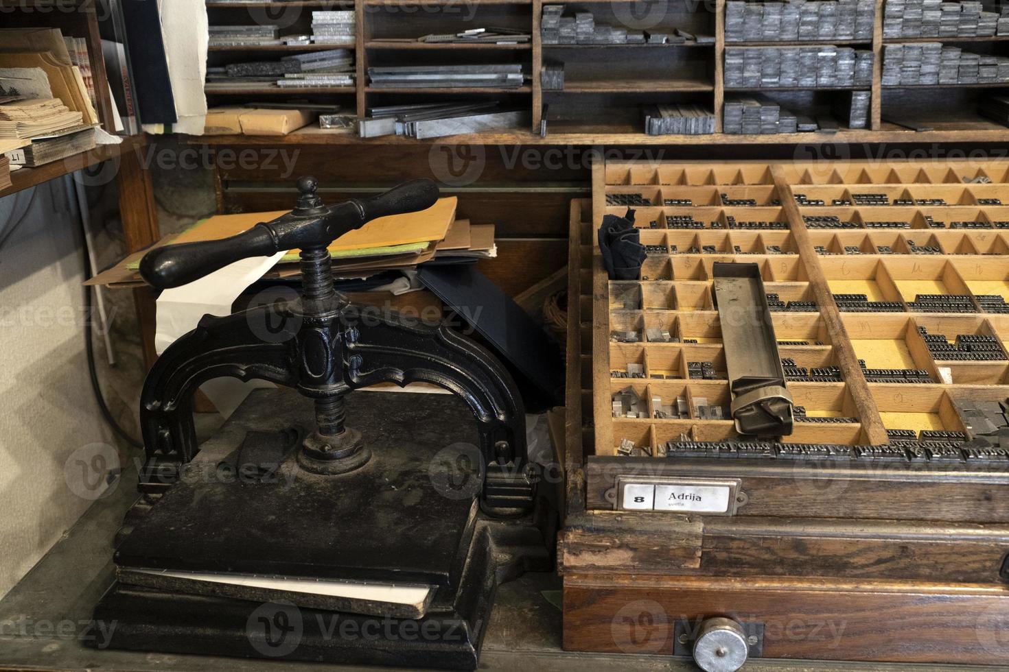 Old ancient print machine hand press photo