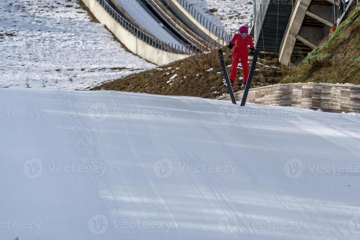 ski jumper while jumping photo