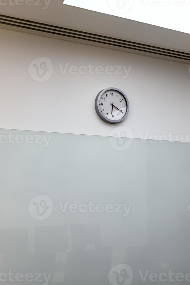clock on wall of empty office photo