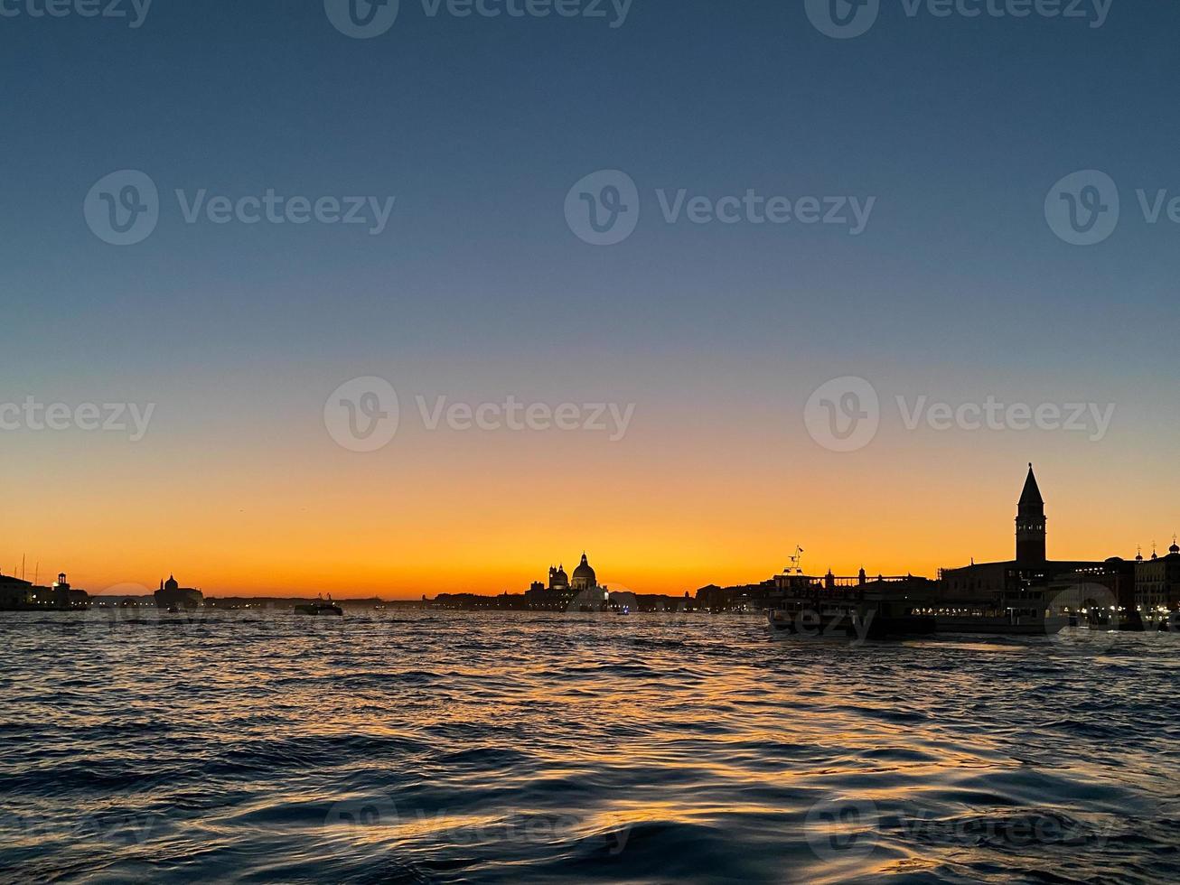 water surface of Venetian lagoon at sunset photo