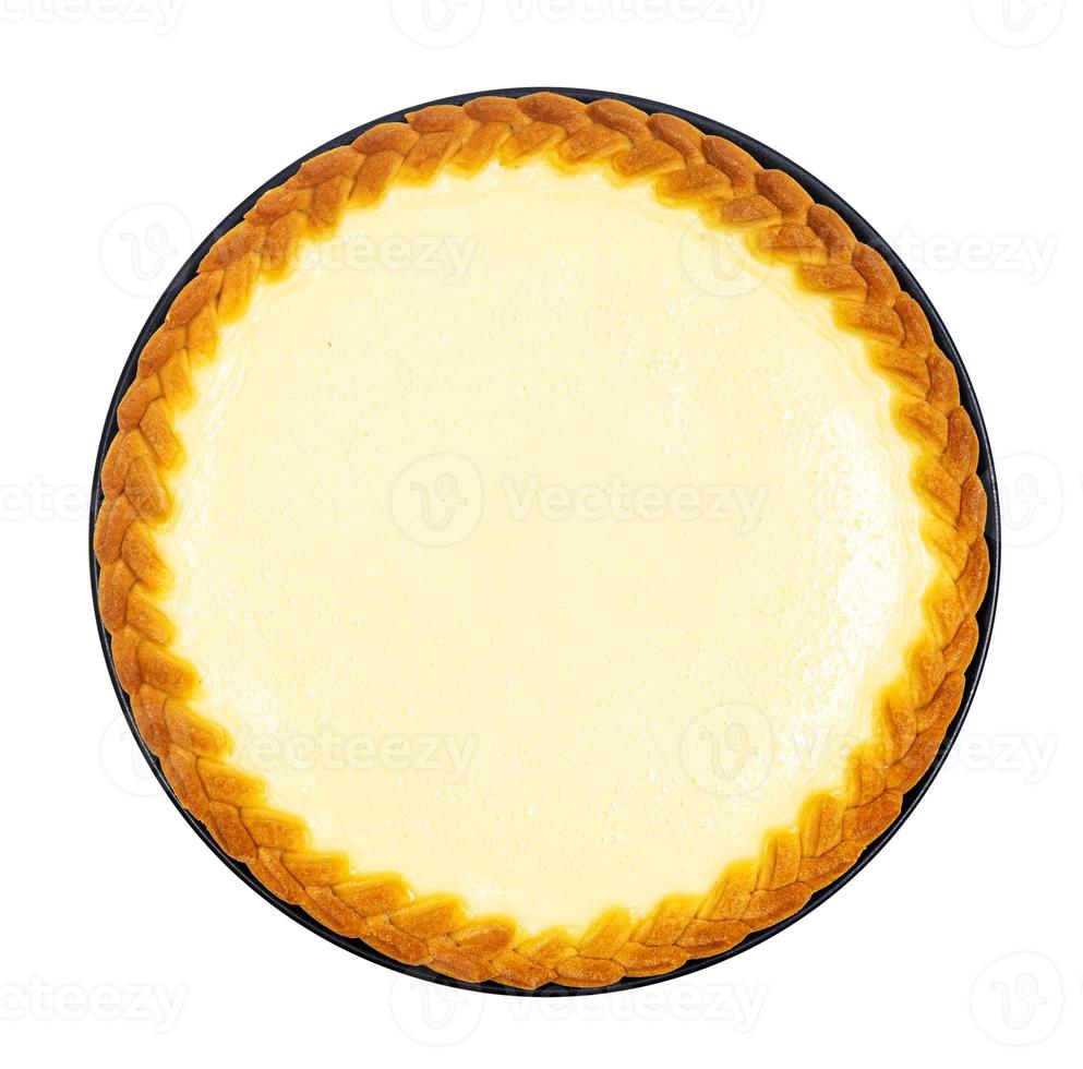 above view of whole cheesecake on plate isolated photo