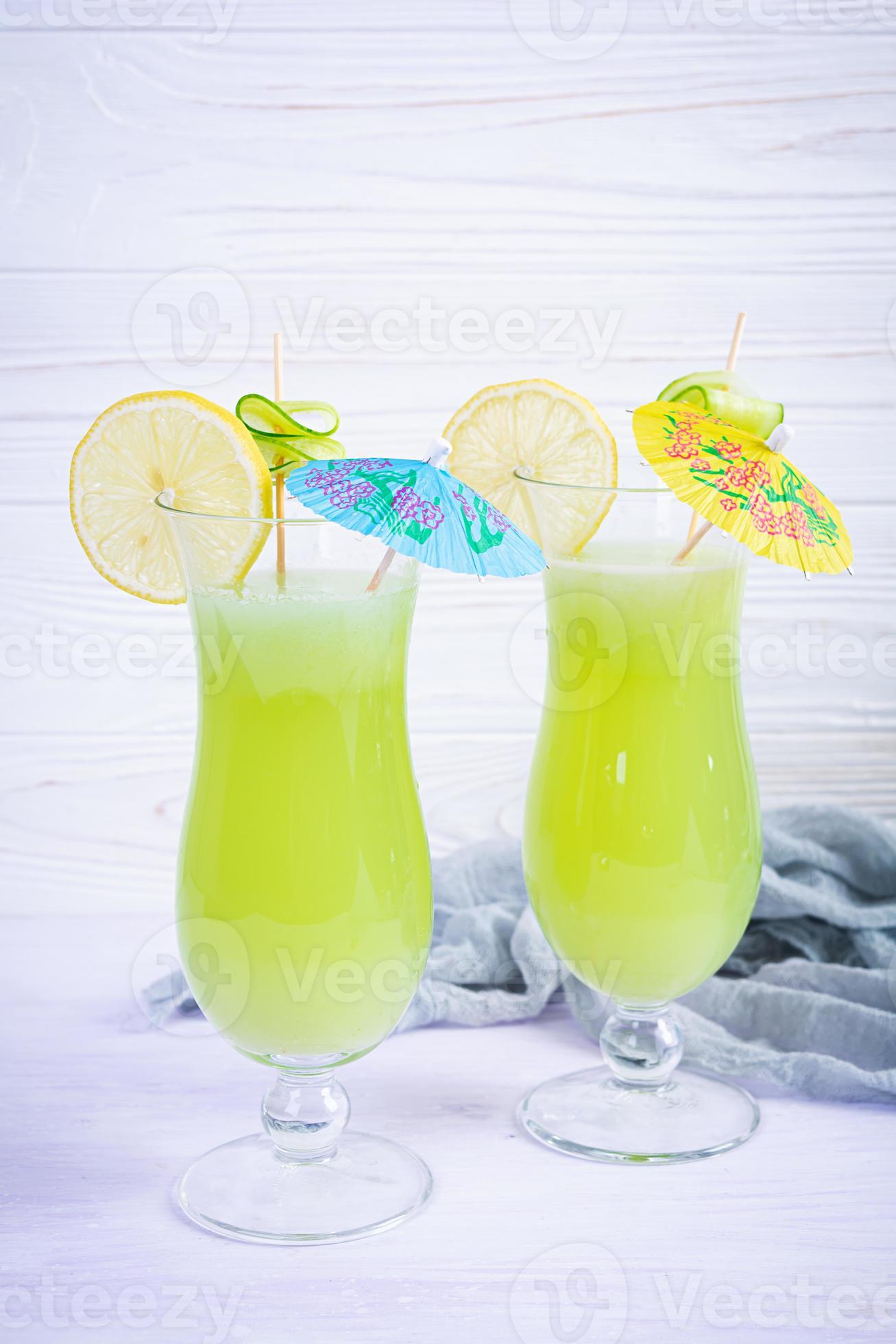 Glass of fresh cucumber juice. Cocktail with cucumber, ice and lemon