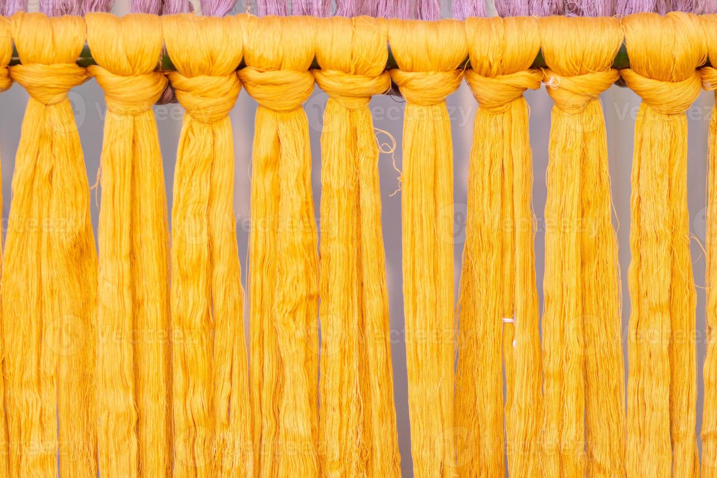 Many of the threads that are dyed brightly are the ones that have been prepared for the traditional loom because the fabric woven on the traditional loom is handmade and expensive. photo