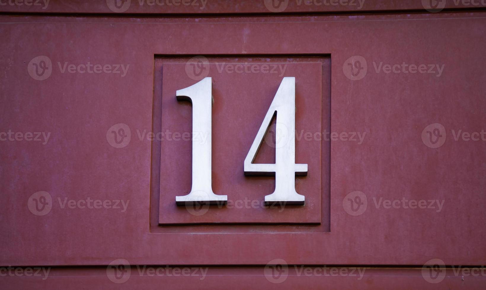 Number fourteen on a wall photo