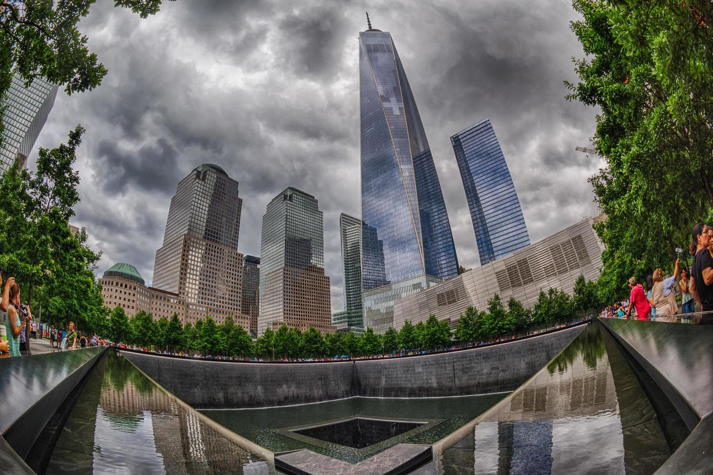 NEW YORK - USA - 13 JUNE 2015 people near freedom tower and 9 11 memorial photo