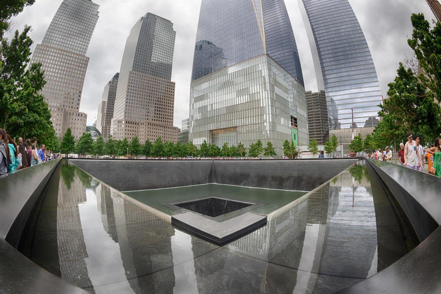 NEW YORK - USA - 13 JUNE 2015 people near freedom tower and 9 11 photo