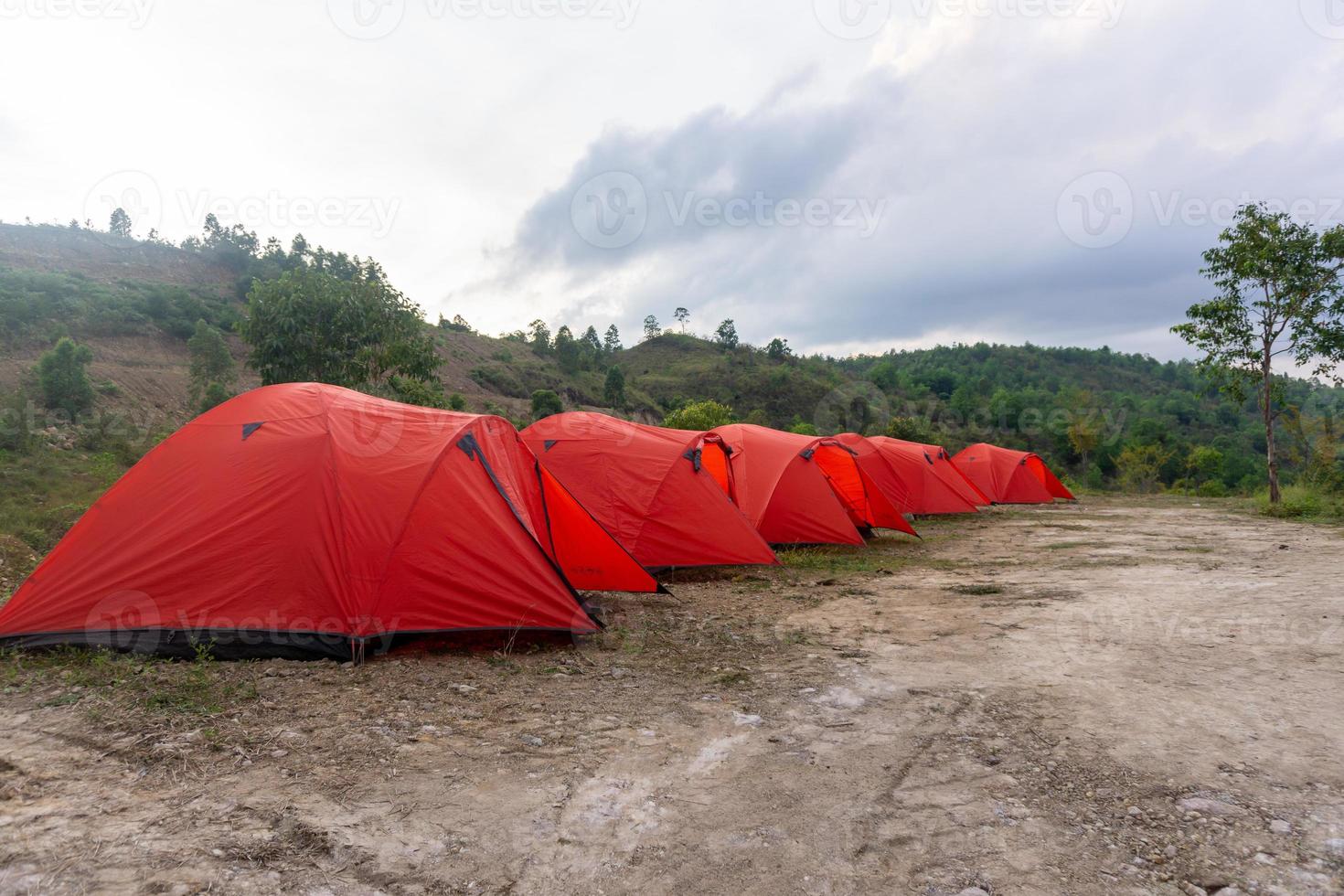 Camp tent area on the mountain. Red tents at the campsite. tourism concept. photo