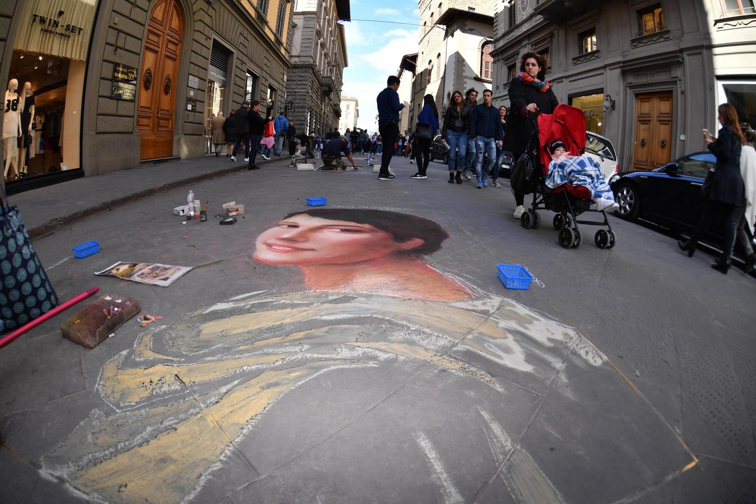 FLORENCE, ITALY - MARCH 27 2017 - Pavement artist painting on the streets photo