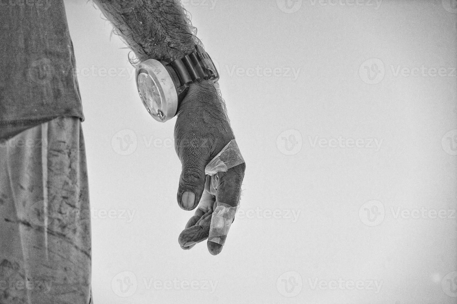 Hand of old fisherman in black and white photo