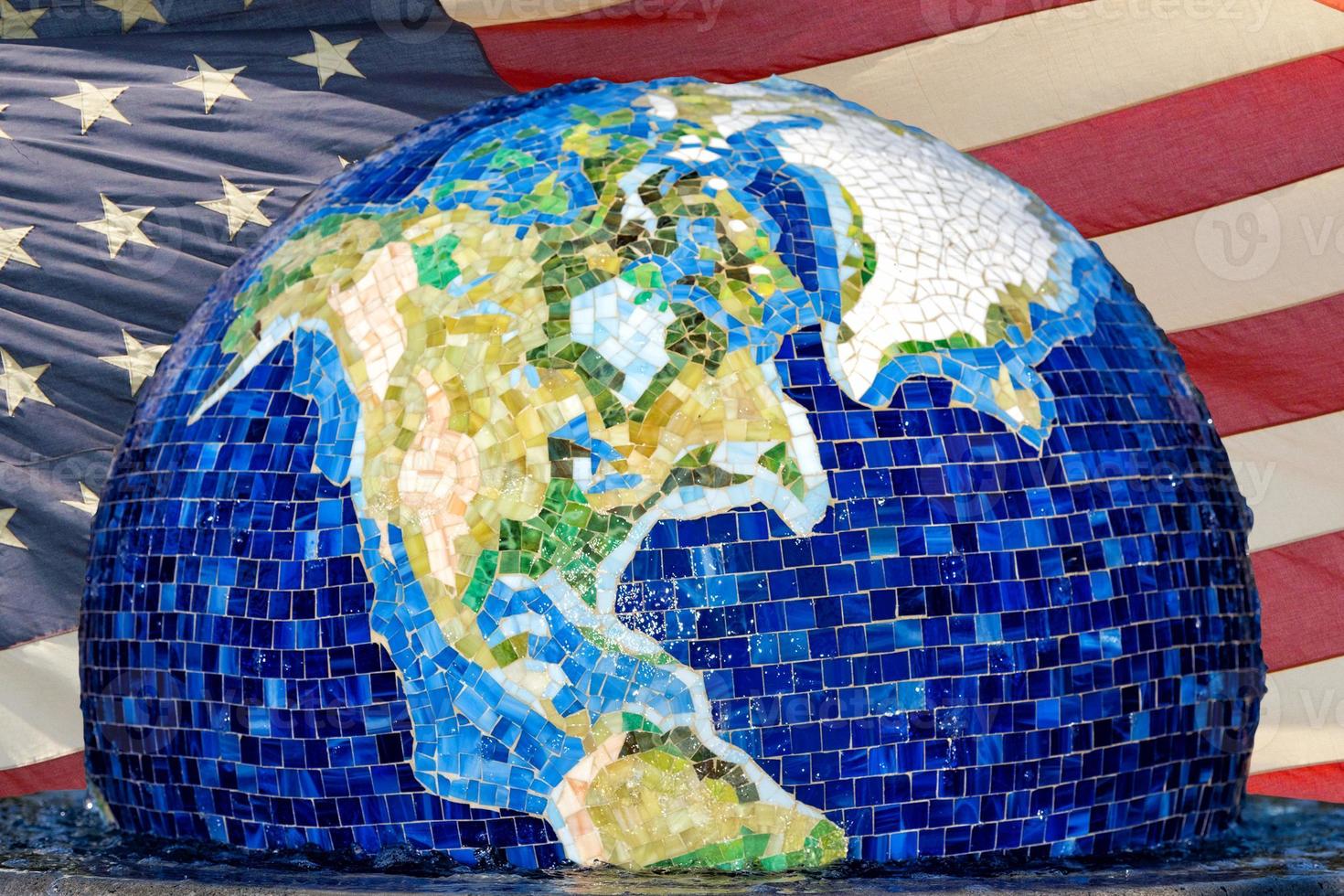 earth globe on usa flag background photo