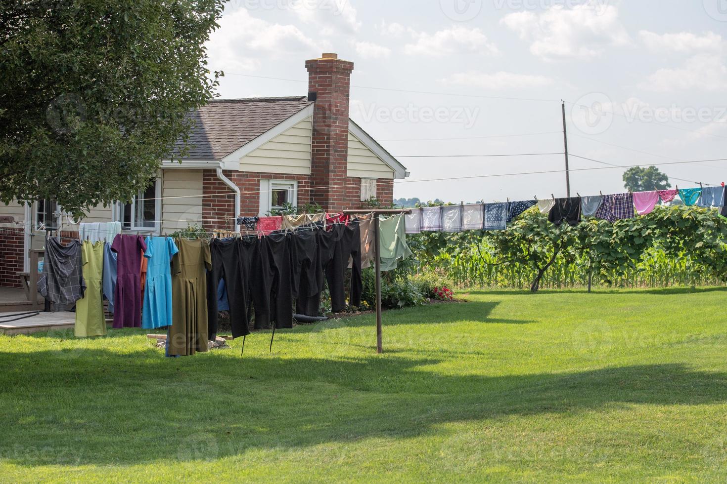 clothes hanging outside amish house in usa photo