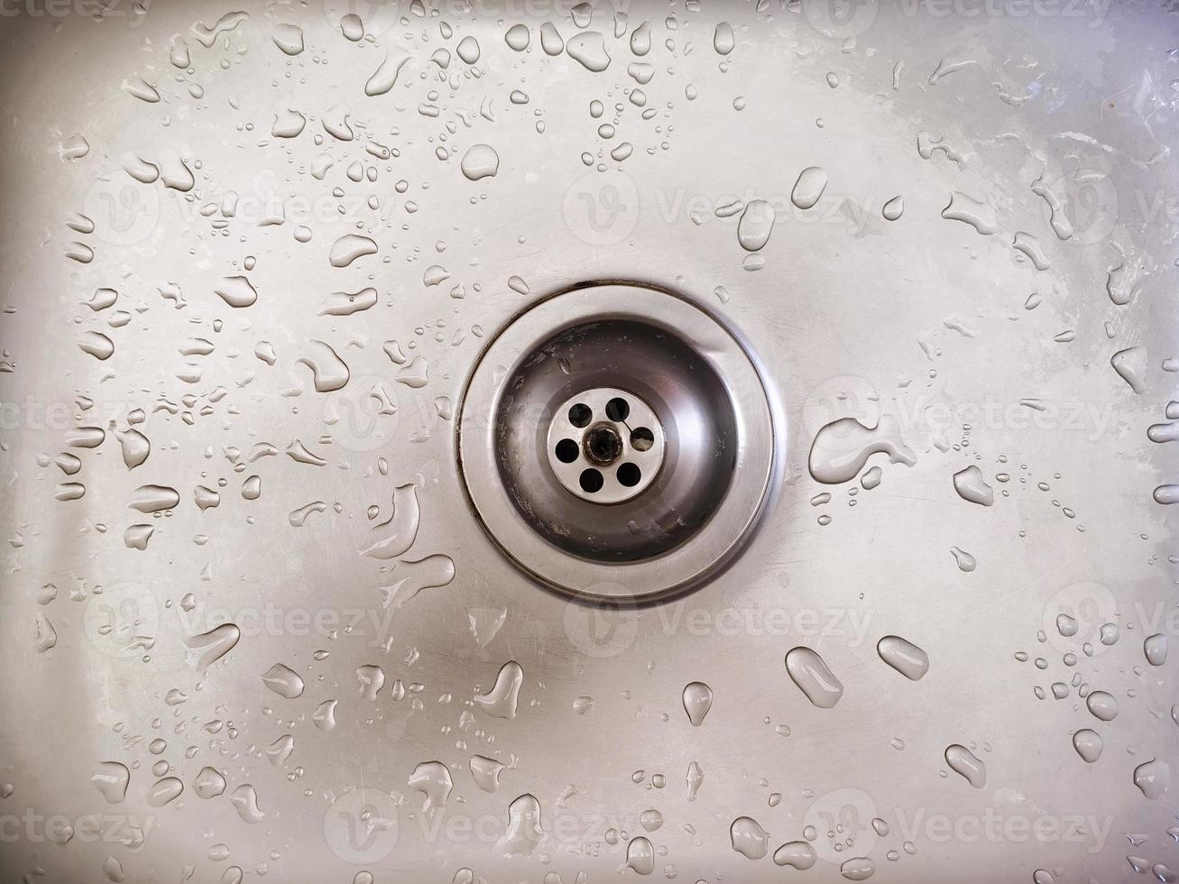 Drops of water after washing your hands in the sink. photo