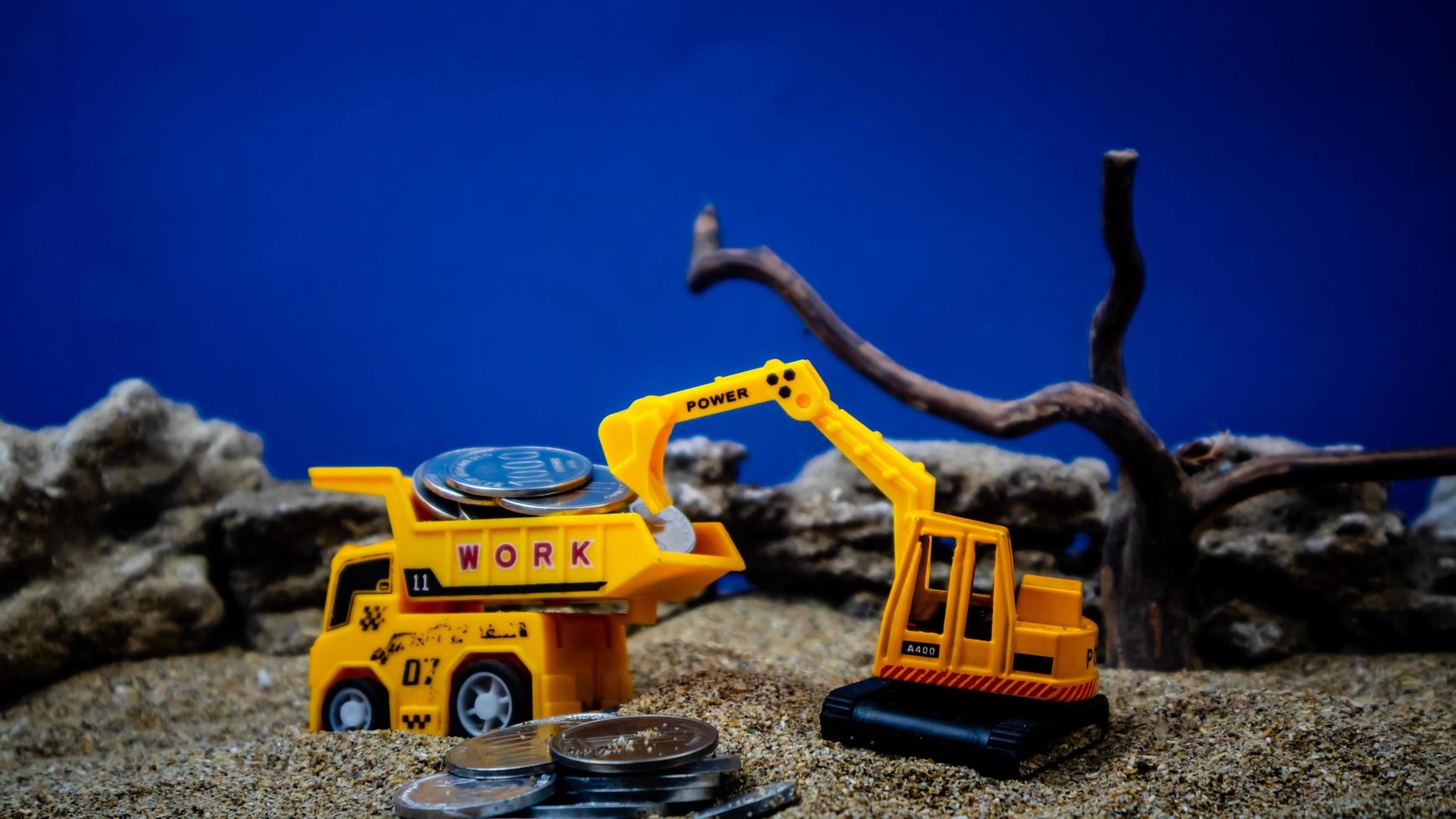 minahasa, Indonesia  January 2023, toy trucks transport coins photo