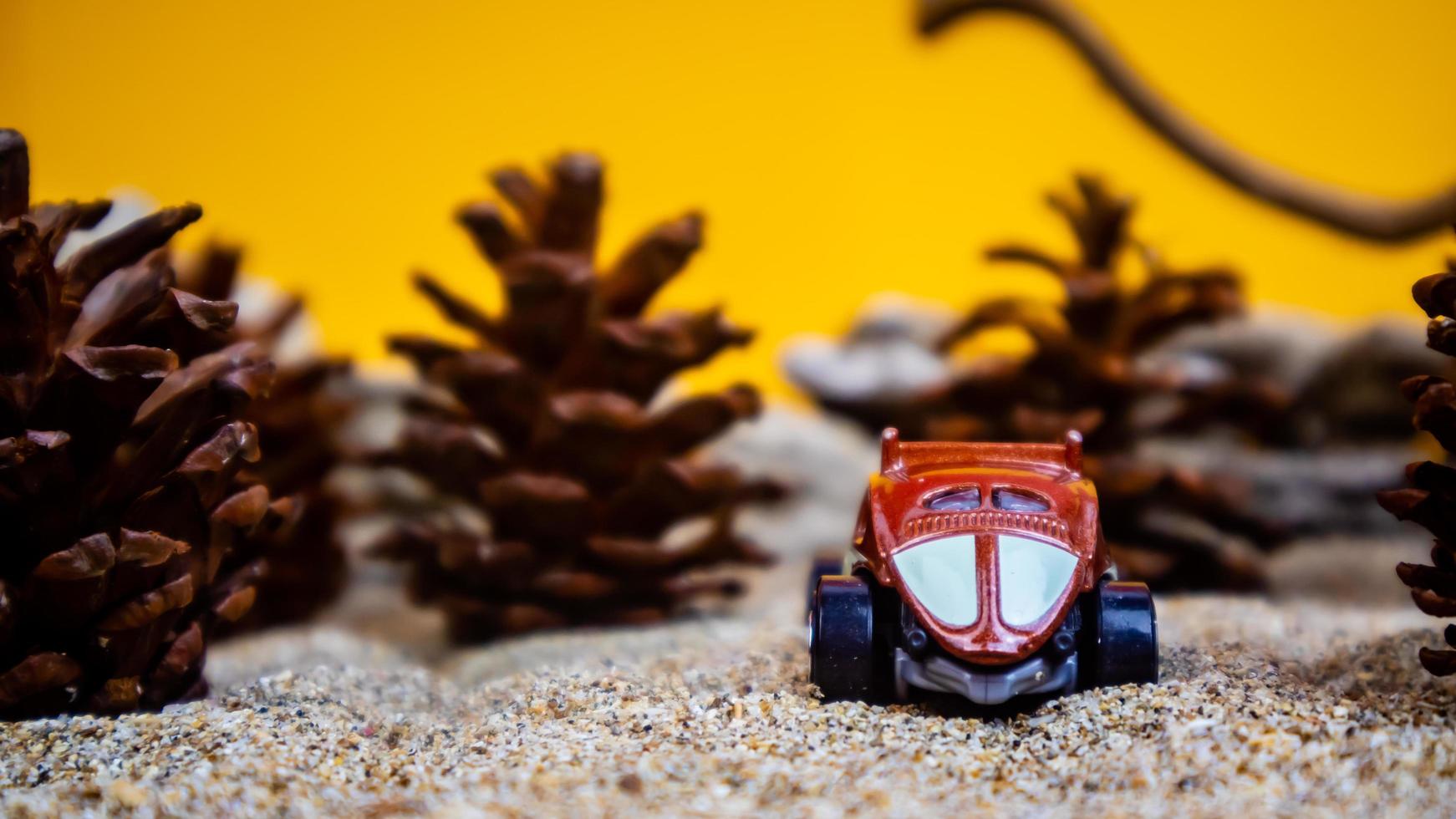 Minahasa, Indonesia  December 2022, the toy car among the pine cones photo