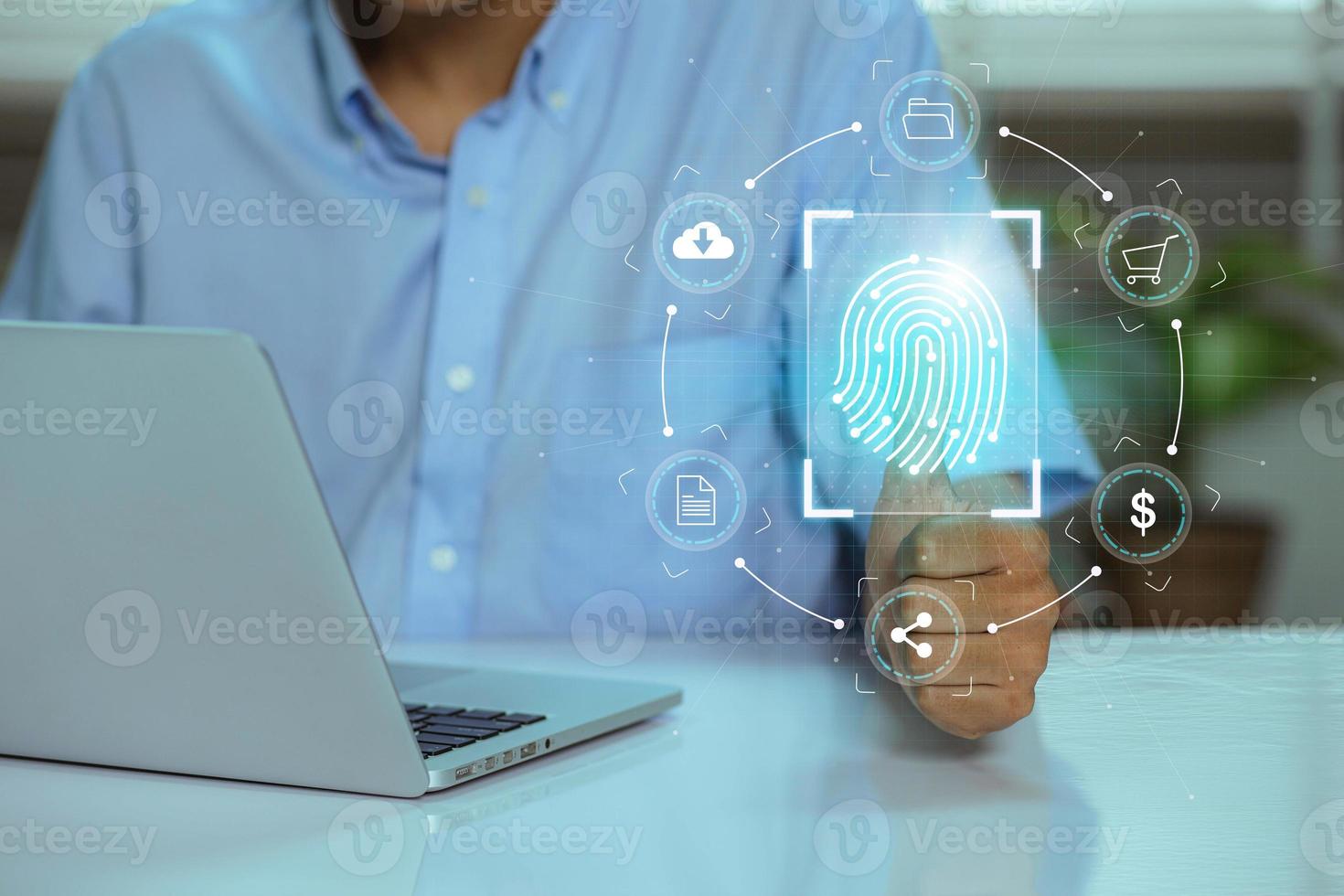 Using fingerprint scanning, the businessman accesses and unlocks the cloud data network. Cyber security and biometric identification protect business transactions from online cyber attacks photo