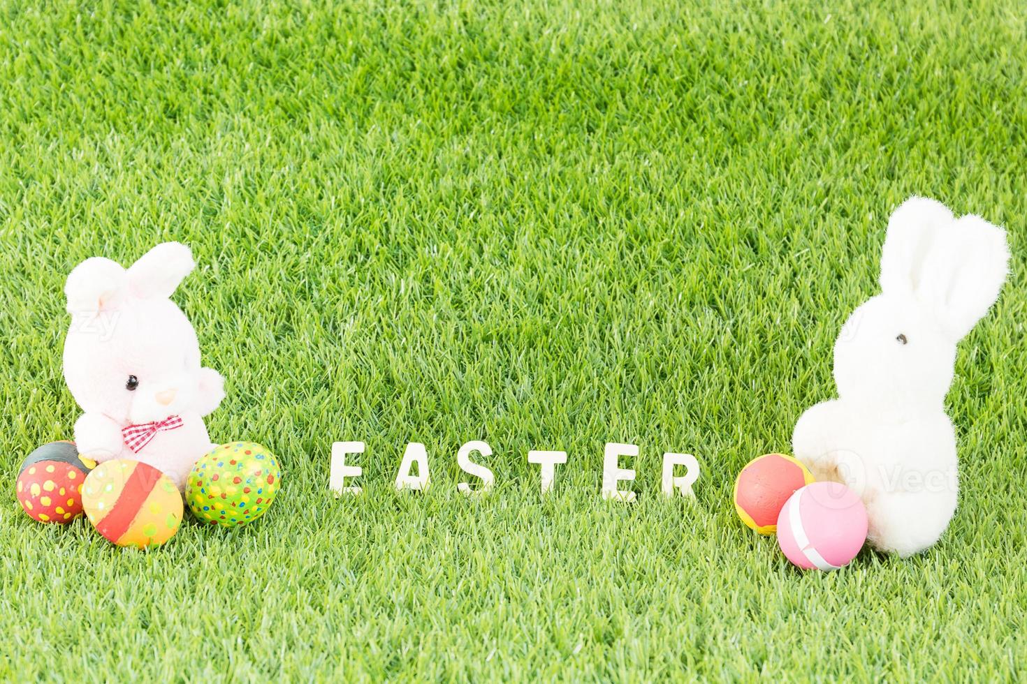 Bunny toy and Easter eggs with text photo