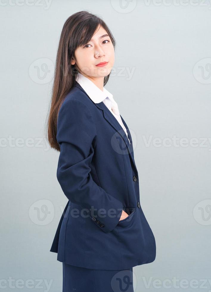 Portrait of asian businesswoman isolated on gray photo