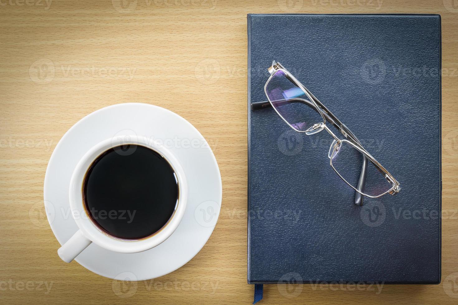 Coffee on wood table and glasses photo