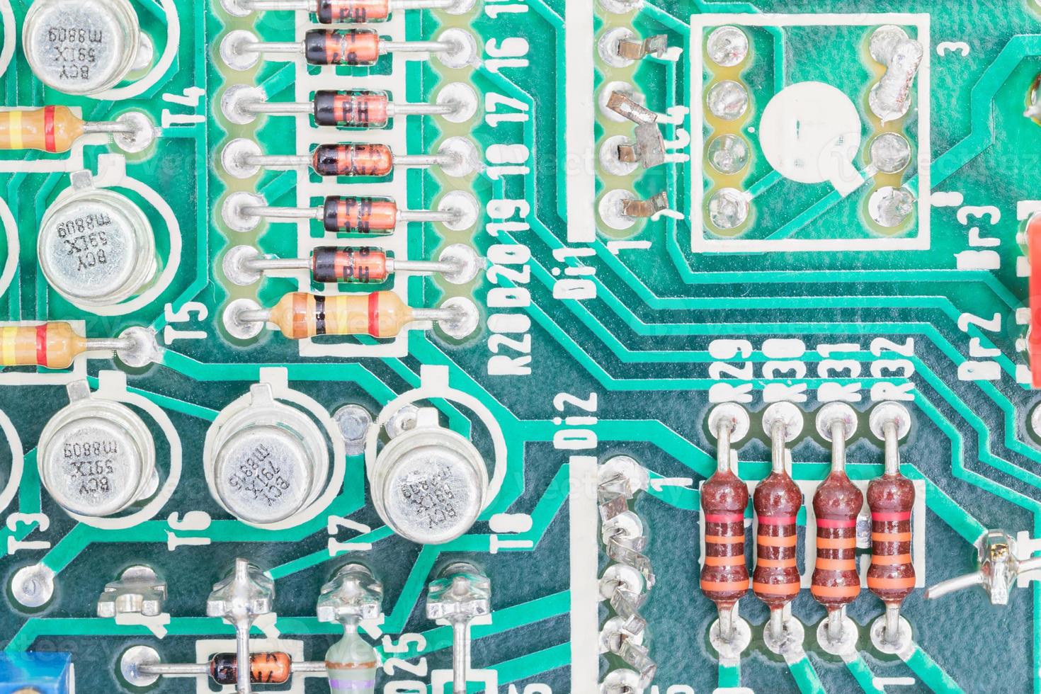 Condensers and Resistor assembly on the circuit board photo