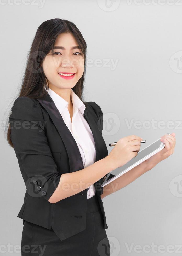 Young women in suit using her digital tablet photo