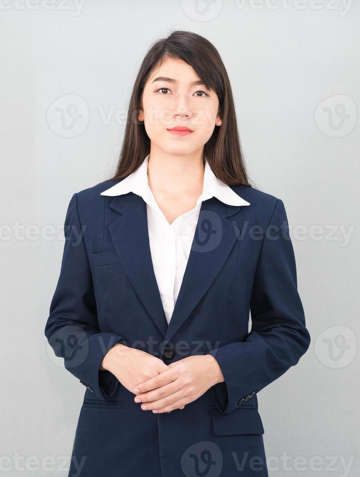 Portrait of asian business woman standing on gray photo