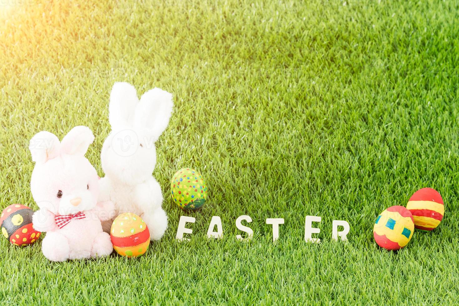 Bunny toys and Easter eggs with text photo