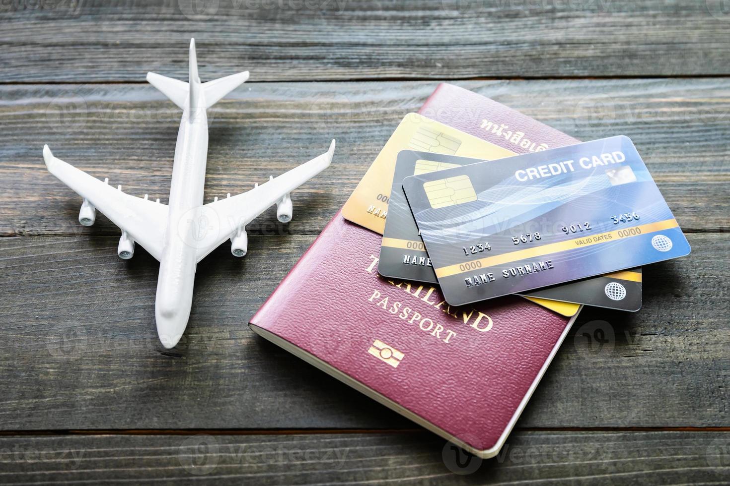 Passport with  credit card on wooden desk photo