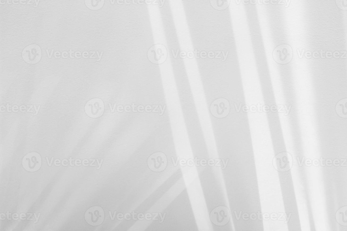 Sunlight on the white rough wall. photo