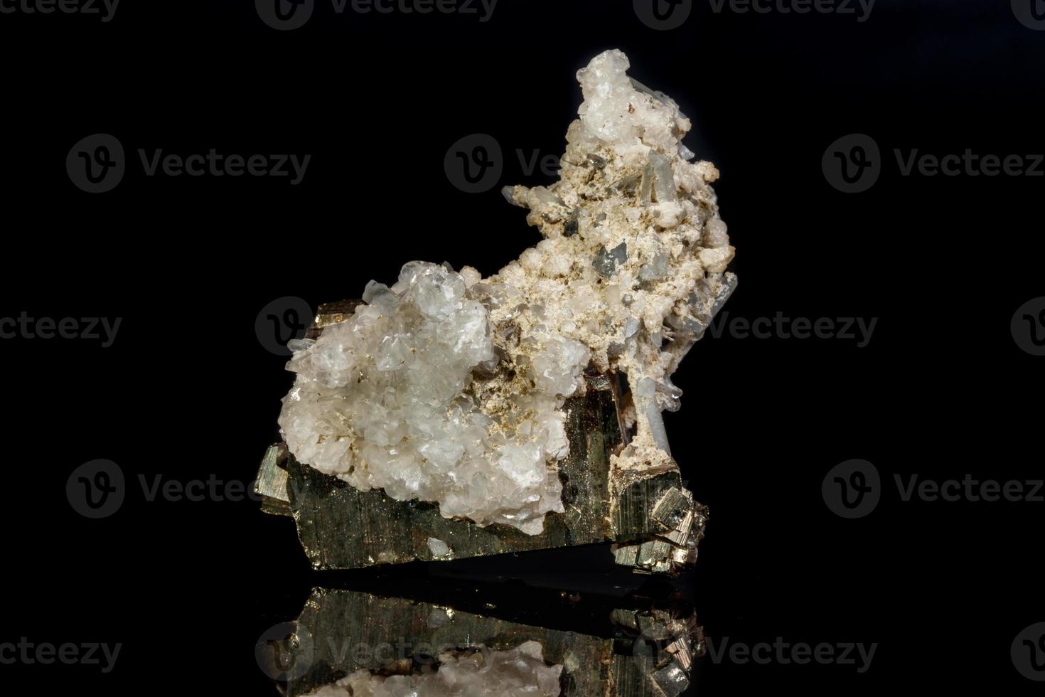 Macro mineral stone Pyrite in quartz on a black background photo