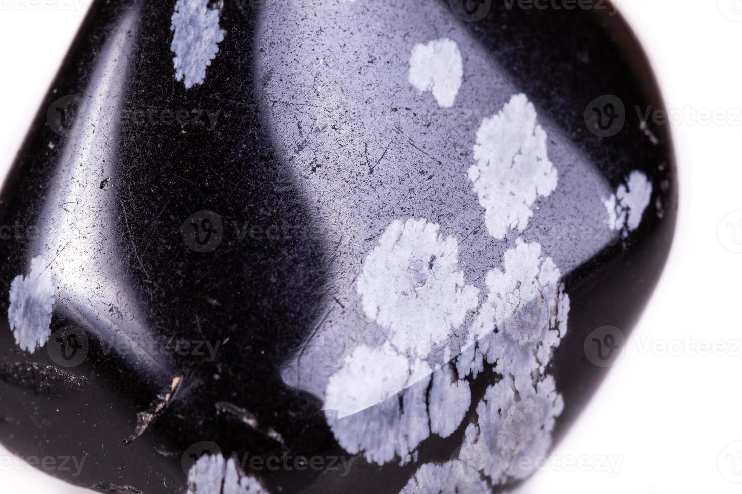 Macro mineral stone snow obsidian on white background photo