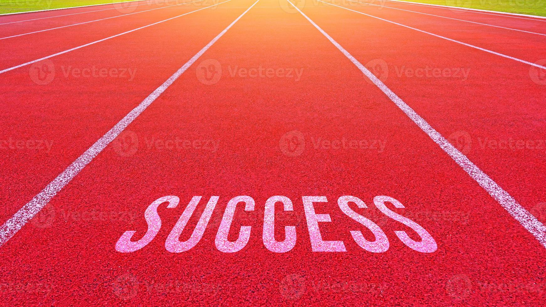 Success text written on an athletics track concept for business planning strategies and challenges or career path opportunities and change, road to success concept photo