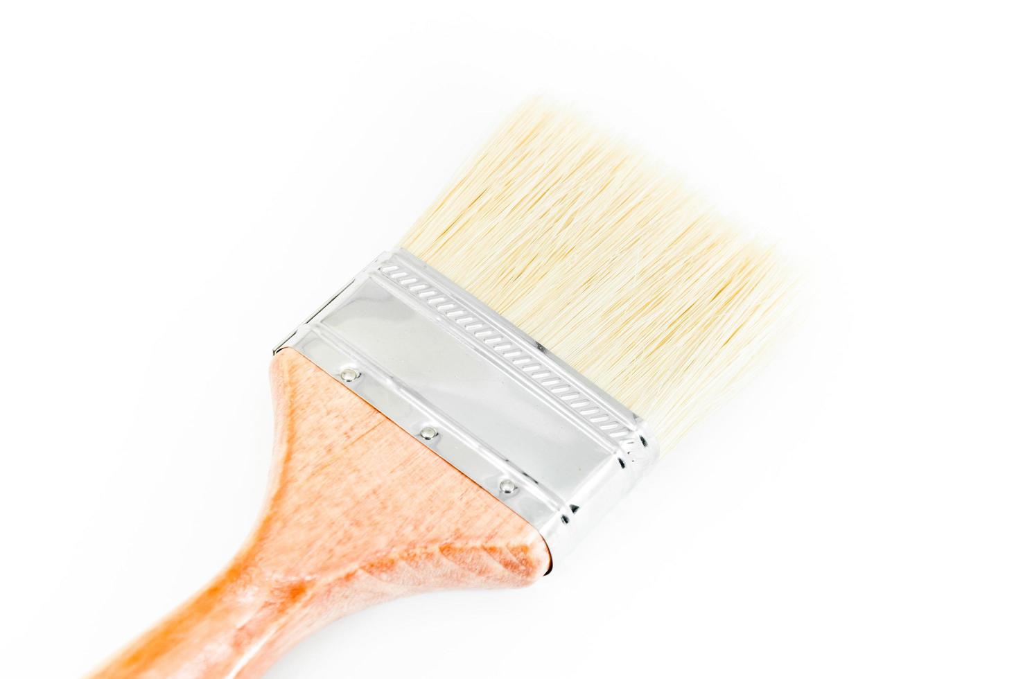 New wood paint brush on white background photo