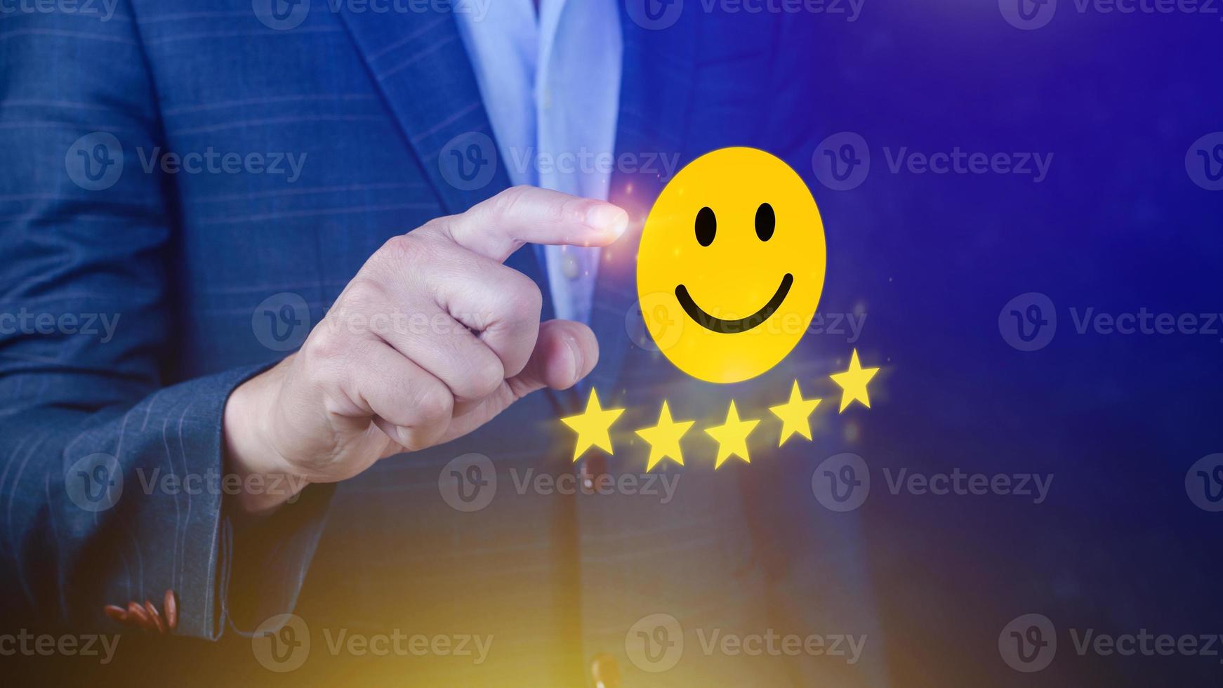 Customer services best excellent business rating experience, Positive Review and Feedback, Satisfaction survey concept. Hand of a businessman show happy smile face with five star. photo