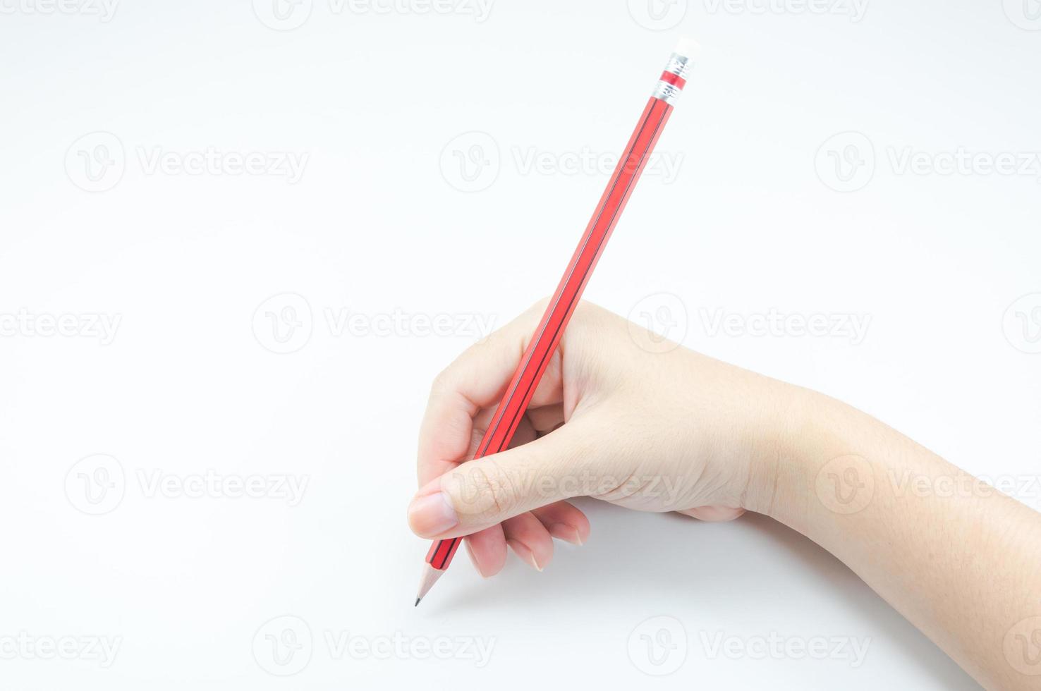 Woman's hand holding with red pencil  on white background photo
