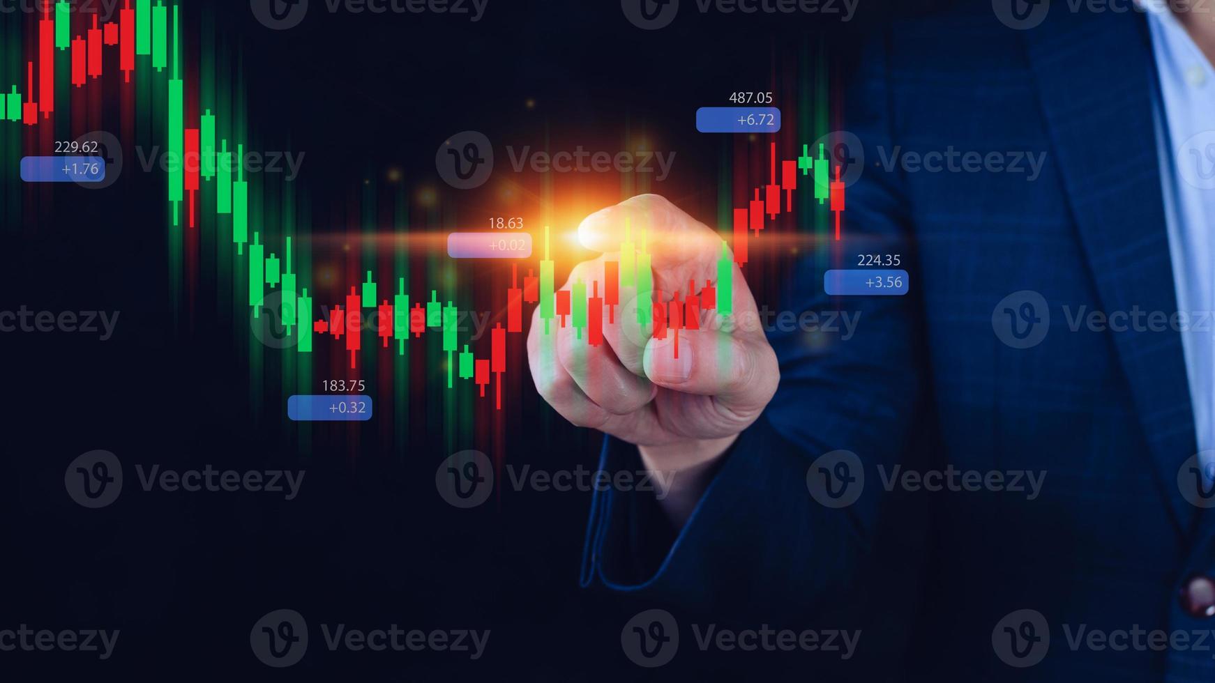 Hand of businessman or trader is touching growing virtual hologram stock, planning and strategy, Stock market, Business growth, progress or success concept. invest in trading. photo
