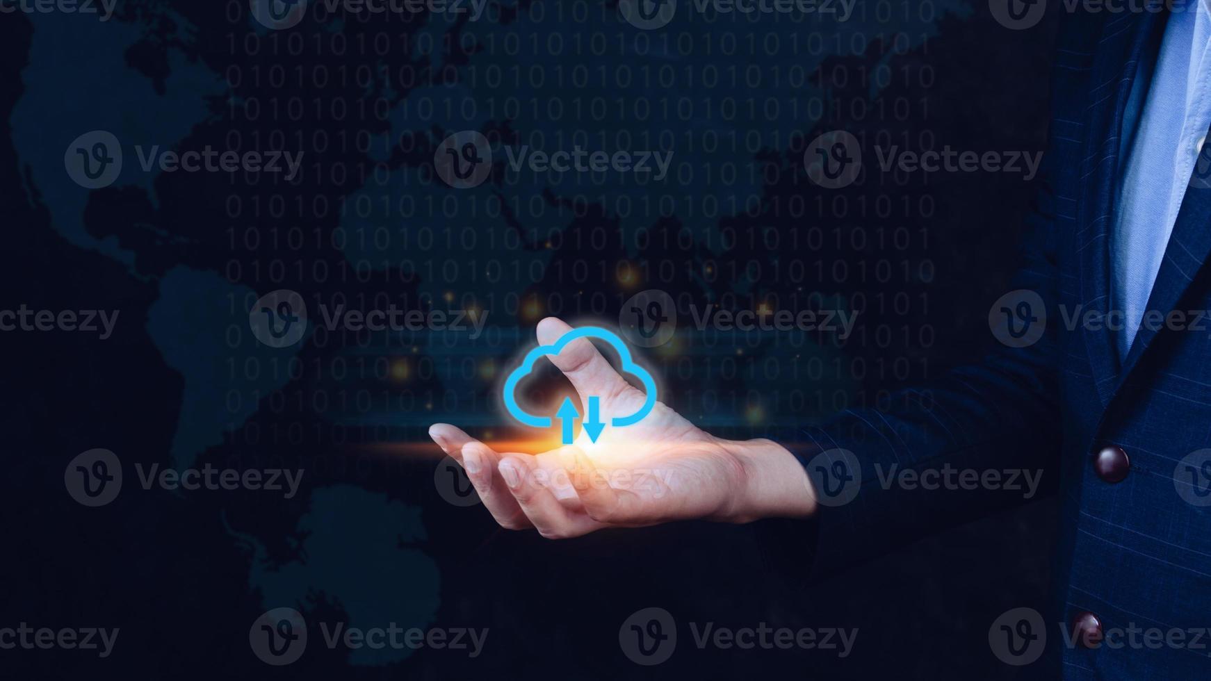 Businessman holding and giving virtual cloud icon computing with world map background to transfer data information and upload download application. technology transformation concept.Big data Concept photo