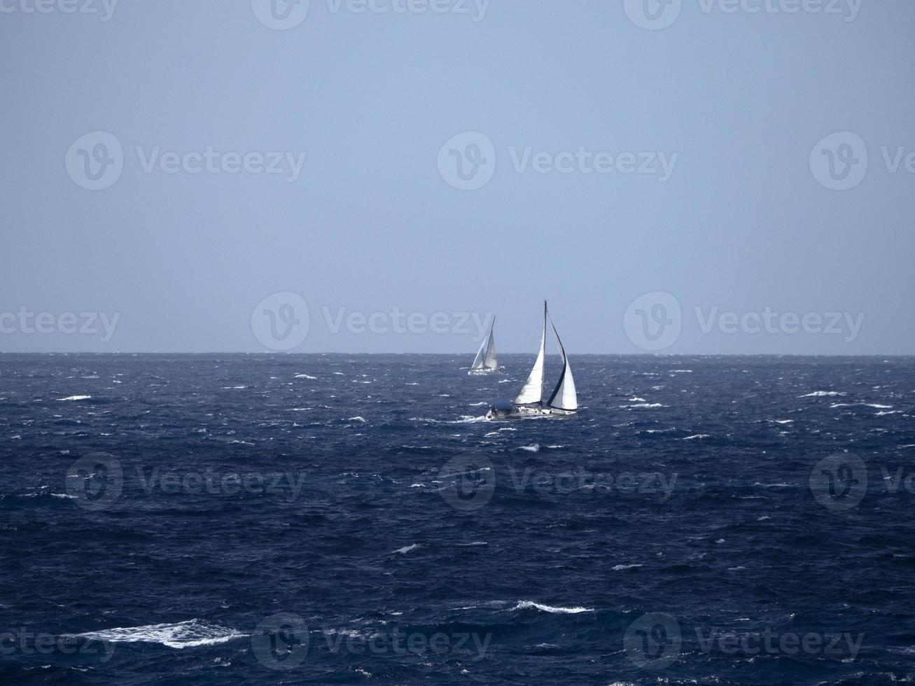 sail boat in high waves sea photo