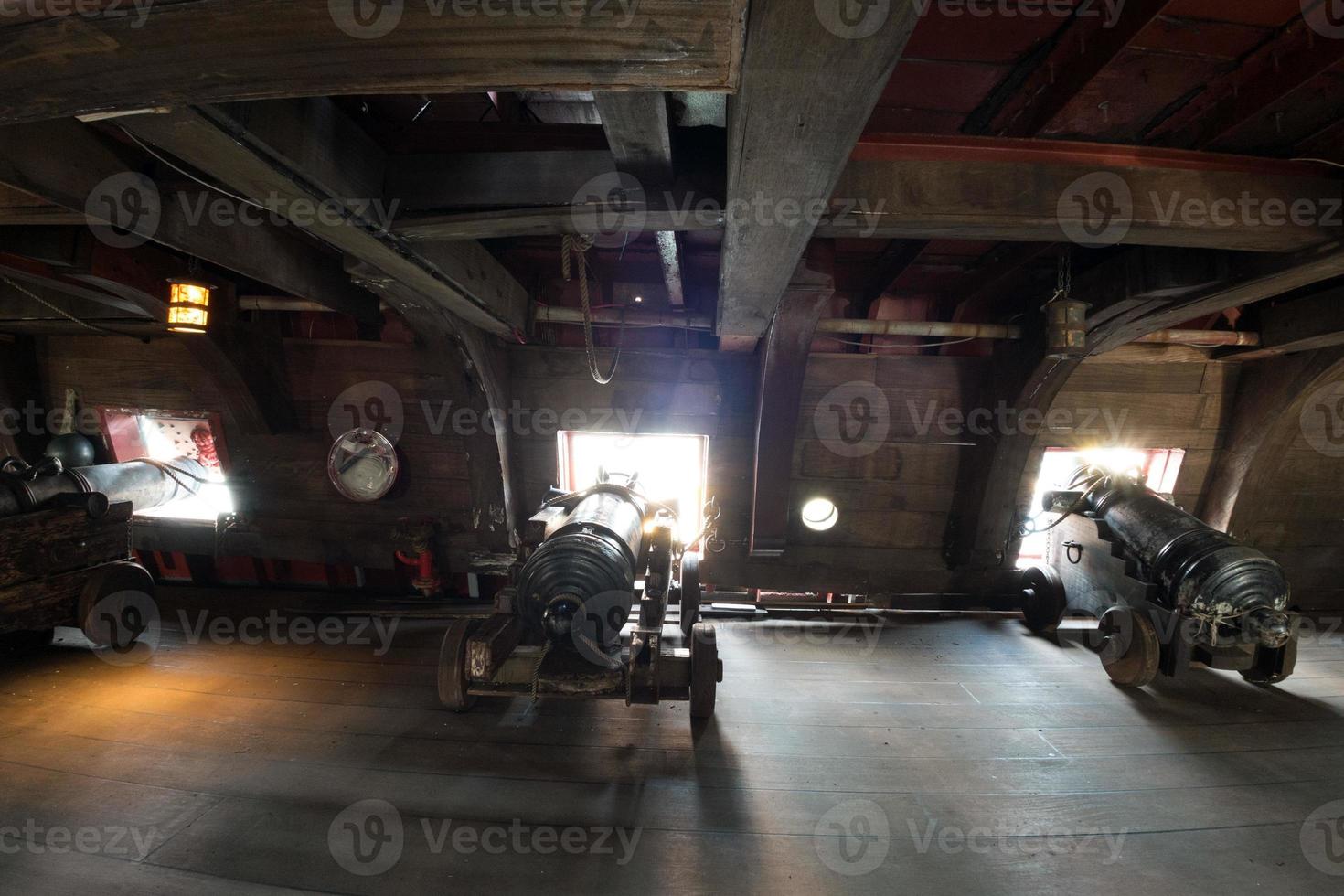 iron cannon on sail ship photo